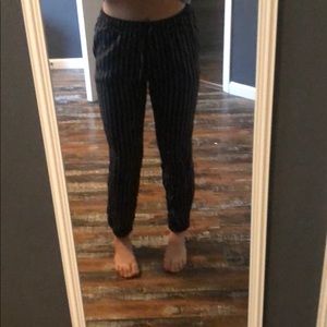 stripped pants cuffed at the bottom